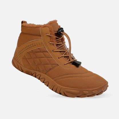 Barefoot hiking boots on snowy mountain trail